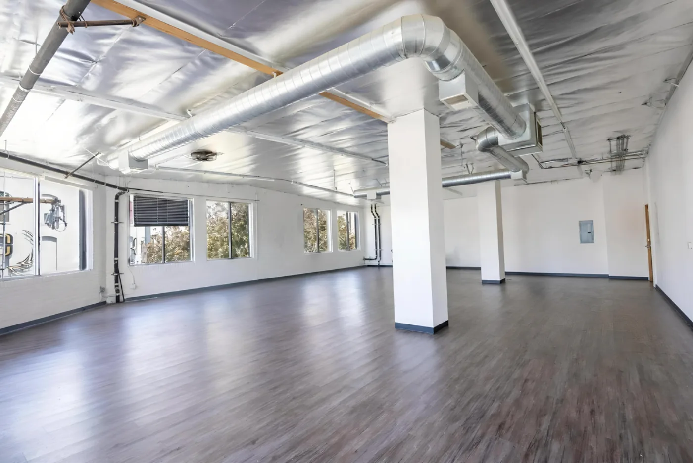 Second-floor suite with natural light and columns