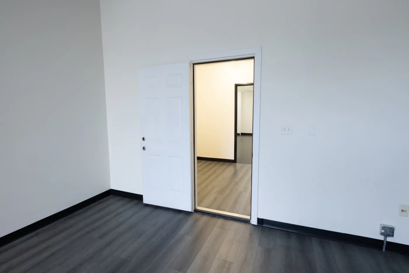 Suite entry opening to an adjoining room