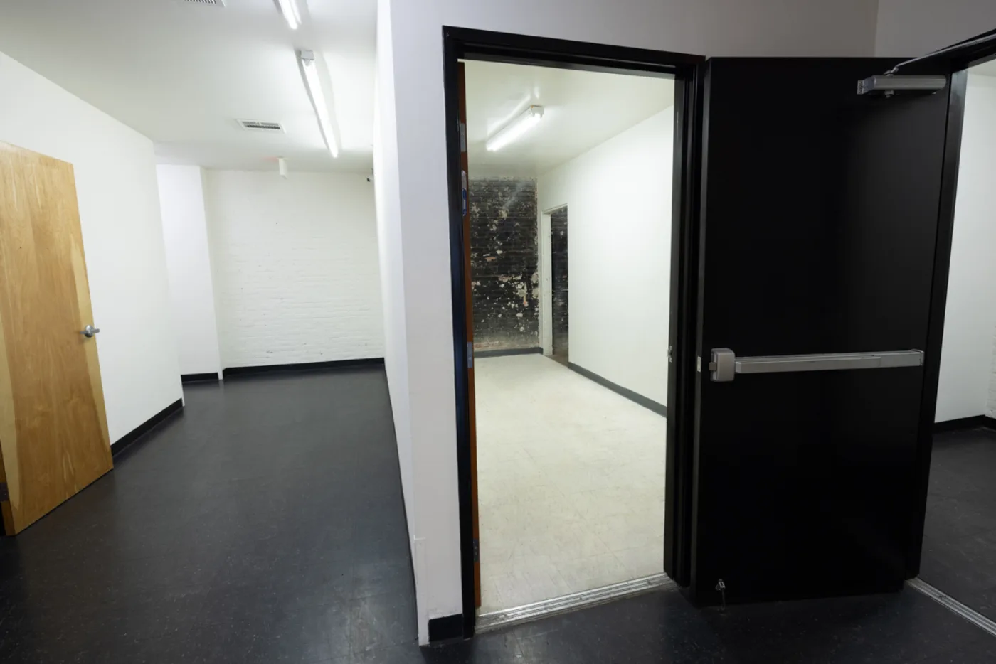 Rear corridor with a secured exit door